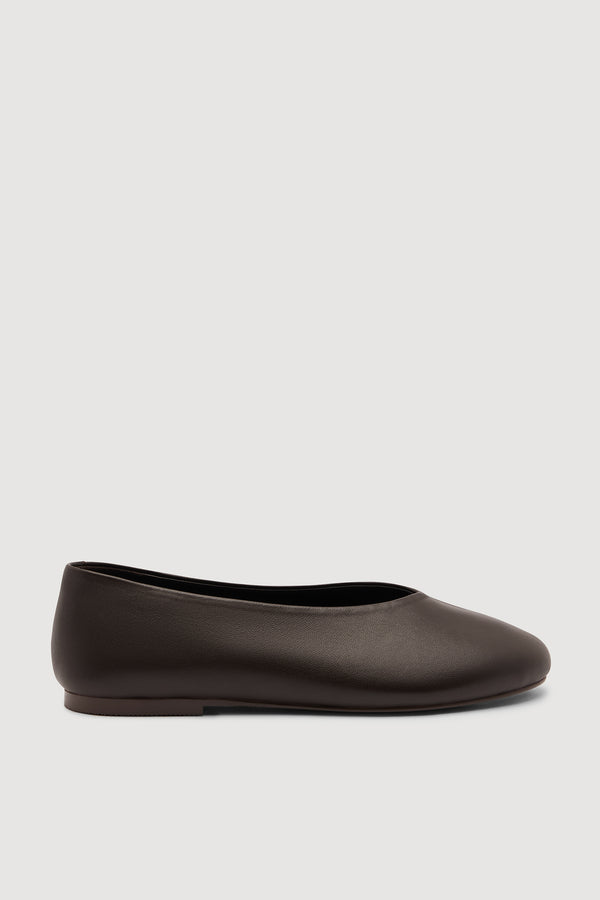 A women's dark brown ballet flat shoe, shown from a side profile view against a white background.